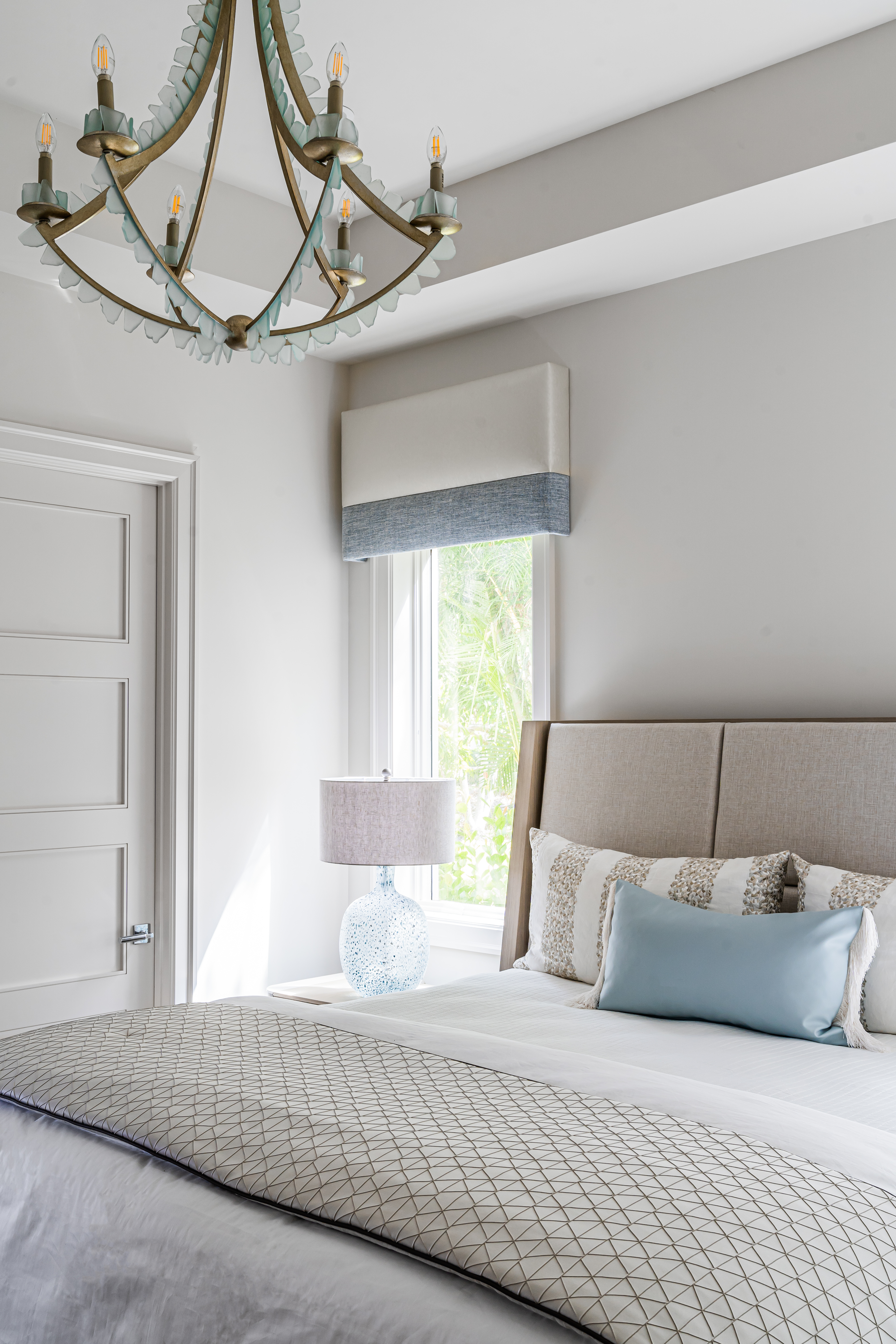 A coastal contemporary guest bedroom design with a neutral palette, designed by Florida interior designer Brooke Meyer of Gulfshore Interior Design