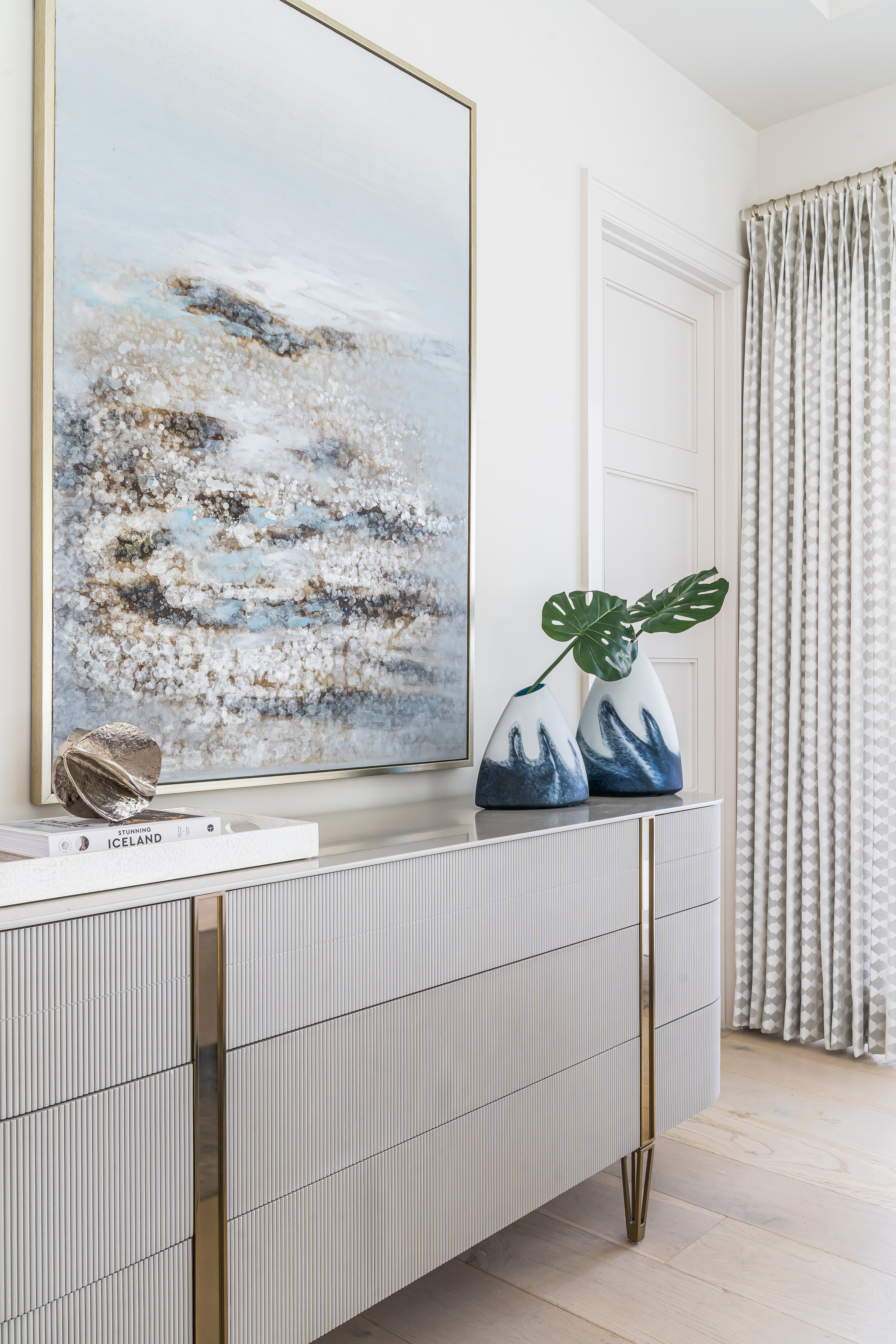 A coastal contemporary guest bedroom custom furniture design with a neutral palette, designed by Florida interior designer Brooke Meyer of Gulfshore Interior Design