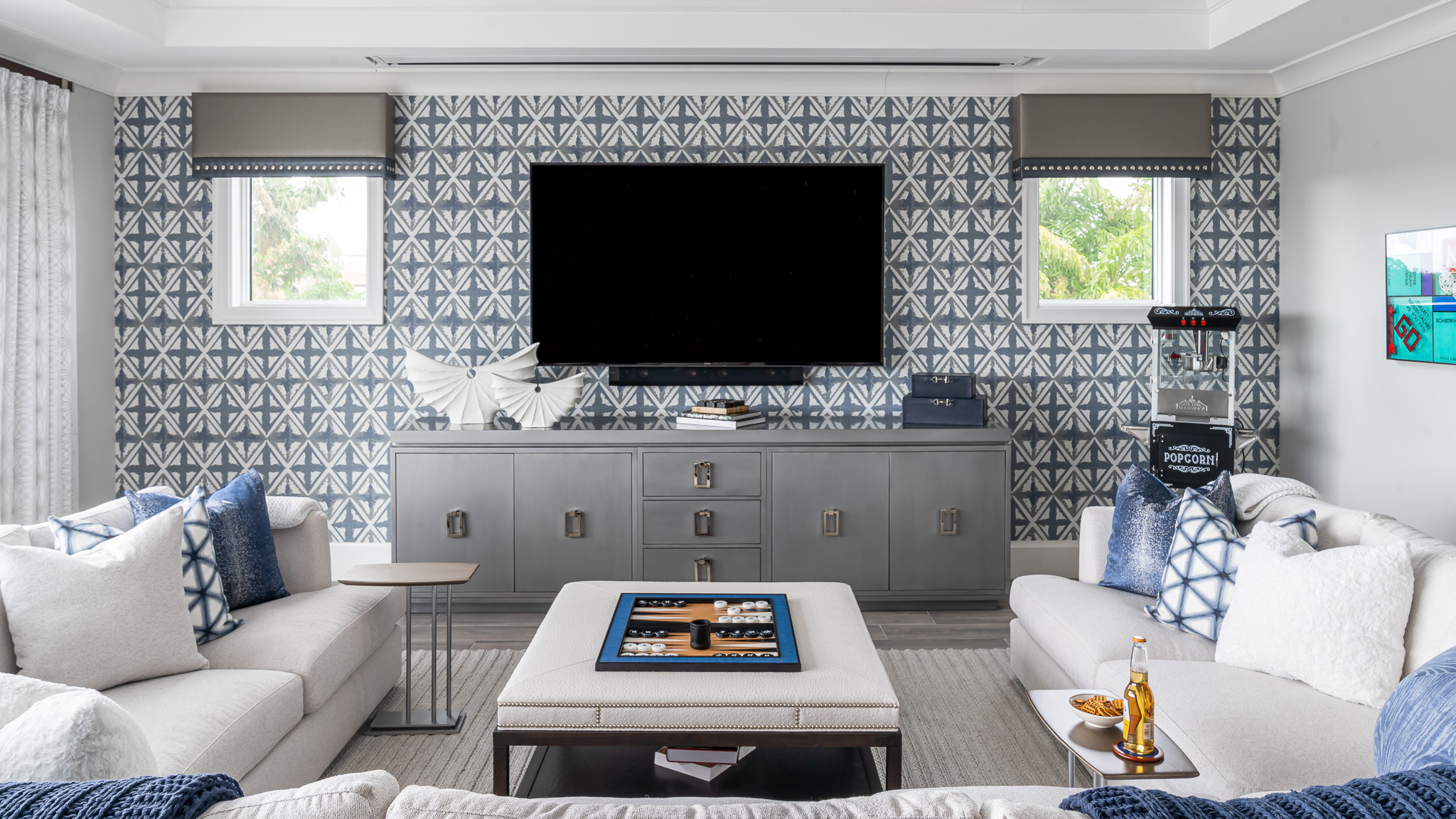 Media room design by Brooke Meyer and Lindsay Molinario of Gulfshore Interior Design - a bold modern design with blues and crisp whites
