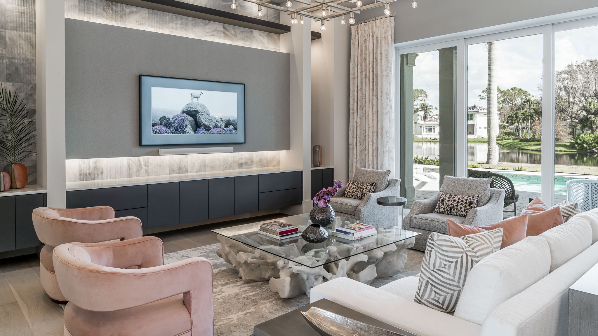 A coastal contemporary living room design with a blush palette, designed by Florida interior designer Brooke Meyer of Gulfshore Interior Design
