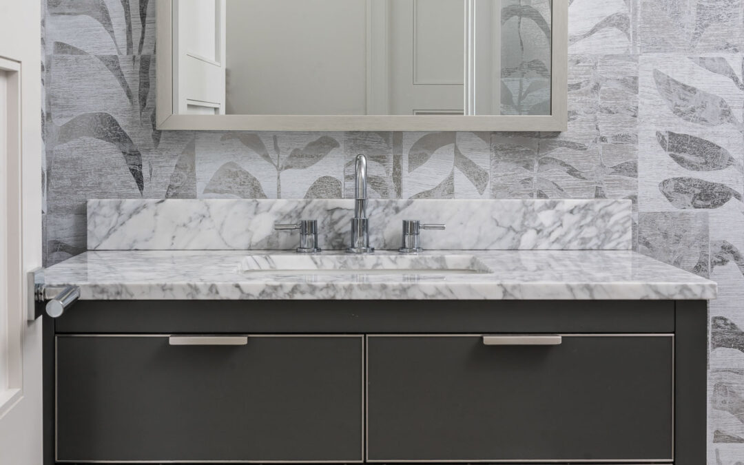 A coastal contemporary powder bathroom design with a neutral palette, designed by Florida interior designer Brooke Meyer of Gulfshore Interior Design