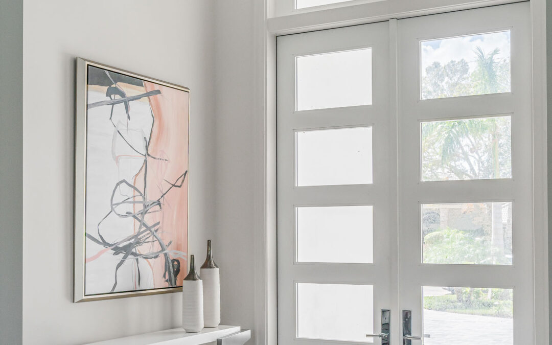 A coastal contemporary entry way design with a blush palette, designed by Florida interior designer Brooke Meyer of Gulfshore Interior Design